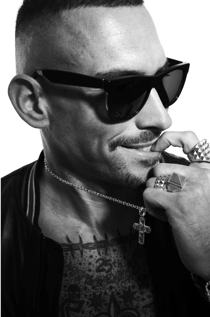 Pietro Bazzani in dark glasses with LEONY rings and cross